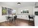 Modern kitchen with white cabinets and breakfast nook at 5818 18Th S Ave, Gulfport, FL 33707