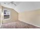 Bright bedroom with carpeted floor and window at 8610 Hawbuck St, Trinity, FL 34655