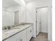 Bathroom boasts a double vanity with granite countertop at 3582 Moscato Dr, Brooksville, FL 34602