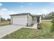 Newly constructed home with a white garage door and landscaped front yard at 3622 Moscato Dr, Brooksville, FL 34602