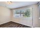 Simple dining area with dark laminate floors and window at 4901 Aegean Ave, Holiday, FL 34690