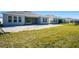 Spacious backyard with grassy area and new home at 1564 Laurel Brook Ln, Port Charlotte, FL 33953