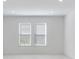 Bright bedroom with two windows and neutral walls at 1564 Laurel Brook Ln, Port Charlotte, FL 33953