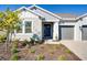 Two-story home with gray two-car garage and manicured landscaping at 1564 Laurel Brook Ln, Port Charlotte, FL 33953