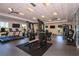 Modern fitness center with various cardio and strength equipment at 1564 Laurel Brook Ln, Port Charlotte, FL 33953