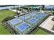 Expansive pickleball courts with surrounding landscaping at 1564 Laurel Brook Ln, Port Charlotte, FL 33953