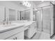 Bright bathroom with double vanity and walk-in shower at 16093 Ivy Ridge Ct, Port Charlotte, FL 33953