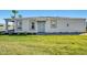 Front view of the house with landscaping and a lake view at 16093 Ivy Ridge Ct, Port Charlotte, FL 33953