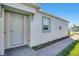 Gray front door and walkway at 16093 Ivy Ridge Ct, Port Charlotte, FL 33953