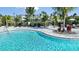 Relaxing pool area with lounge chairs and umbrellas at 16093 Ivy Ridge Ct, Port Charlotte, FL 33953
