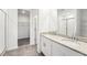 Modern bathroom with double vanity and walk-in shower at 31650 Malbec Dr, Brooksville, FL 34602