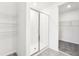 Clean bathroom with walk-in shower and shelving at 31650 Malbec Dr, Brooksville, FL 34602