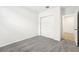 Bedroom with grey carpet and door to bathroom at 31650 Malbec Dr, Brooksville, FL 34602