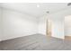 Bedroom with grey carpet and access to bathroom at 31650 Malbec Dr, Brooksville, FL 34602