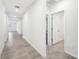 Bright hallway with tile flooring and access to bedrooms at 31650 Malbec Dr, Brooksville, FL 34602
