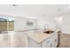 Kitchen island with granite countertop and stainless steel sink at 31650 Malbec Dr, Brooksville, FL 34602