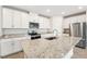 Modern kitchen featuring granite countertops and stainless steel appliances at 31650 Malbec Dr, Brooksville, FL 34602
