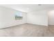 Bright and airy living area with tile floors and a window at 31650 Malbec Dr, Brooksville, FL 34602