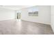 Living area with tile floors and sliding glass doors leading to patio at 31650 Malbec Dr, Brooksville, FL 34602