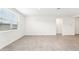 Spacious living room with tile floors and lots of natural light at 31650 Malbec Dr, Brooksville, FL 34602