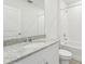 Bathroom with granite countertop and white vanity at 31698 Wild Grape Ln, Brooksville, FL 34602