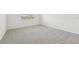 Spacious bedroom with carpeted floor and large window at 31698 Wild Grape Ln, Brooksville, FL 34602
