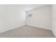 Spacious bedroom with window and carpet flooring at 31698 Wild Grape Ln, Brooksville, FL 34602