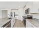 Bright kitchen with stainless steel appliances and granite countertops at 31698 Wild Grape Ln, Brooksville, FL 34602