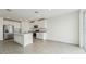 Open kitchen featuring white cabinets, granite countertops, and stainless steel appliances at 31698 Wild Grape Ln, Brooksville, FL 34602