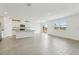 Modern kitchen with white cabinets, granite countertops, and stainless steel appliances at 31698 Wild Grape Ln, Brooksville, FL 34602