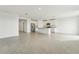 Open kitchen with white cabinets, center island, and stainless steel appliances at 31698 Wild Grape Ln, Brooksville, FL 34602