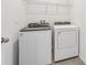 Laundry room with Whirlpool washer and dryer at 31698 Wild Grape Ln, Brooksville, FL 34602