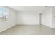 Living room with tile floors and large window at 31698 Wild Grape Ln, Brooksville, FL 34602