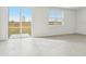 Living room with tile floor and sliding door to patio at 31698 Wild Grape Ln, Brooksville, FL 34602