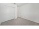 Bedroom with double door closet and carpet at 31703 Wild Grape Ln, Brooksville, FL 34602