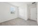 Bright bedroom with double door closet and window at 31703 Wild Grape Ln, Brooksville, FL 34602