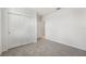Bedroom with double door closet and access to bathroom at 31703 Wild Grape Ln, Brooksville, FL 34602