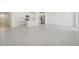 Modern kitchen with white cabinets, stainless steel appliances, and an island at 31703 Wild Grape Ln, Brooksville, FL 34602