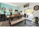 Bright dining area with table, bench, and view of the backyard at 7729 Rosewood Garden Loop, Tampa, FL 33637