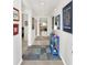 Bright entryway with blue accent table and view to living room at 7729 Rosewood Garden Loop, Tampa, FL 33637