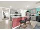 Modern kitchen with granite island, stainless steel appliances, and gray cabinets at 7729 Rosewood Garden Loop, Tampa, FL 33637