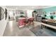 Open kitchen with gray cabinets, an island, and dining area at 7729 Rosewood Garden Loop, Tampa, FL 33637
