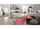Kitchen features granite countertops, gray cabinets, and a breakfast bar at 7729 Rosewood Garden Loop, Tampa, FL 33637