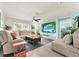 Spacious living room with large sectional sofa and flat-screen TV at 7729 Rosewood Garden Loop, Tampa, FL 33637