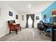 Home office with a desk, chair, and blue accent wall at 7729 Rosewood Garden Loop, Tampa, FL 33637