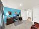 Home office with a desk, chair, and blue accent wall at 7729 Rosewood Garden Loop, Tampa, FL 33637
