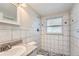 Clean bathroom with a shower/tub combo and granite countertop vanity at 7311 Buchanan Dr, Port Richey, FL 34668