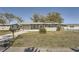 Charming single story home with a well-manicured lawn and screened porch at 7311 Buchanan Dr, Port Richey, FL 34668
