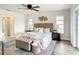 Bright bedroom with a comfortable bed and stylish decor at 7384 Van Lake Dr, Englewood, FL 34224