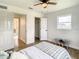 Spacious bedroom with wood flooring, plenty of closet space, and neutral tones at 7384 Van Lake Dr, Englewood, FL 34224